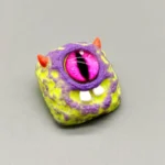 big-eyed-monster-keycaps-green-purple-teeth