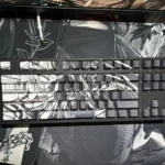 Multiple angles of the epic hand-sculpted Attack on Titan artisan keycap set, showcasing its intricate beast-form details and stunning translucent.