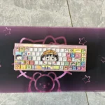 Chibi Maruko-chan Keycaps set, vibrantly illustrating the side-engraved characters and dynamic backlit effect across multiple keycap views.