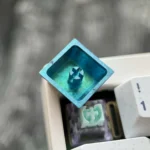 Frieren titanium keycap gallery in stunning ice crystal blue. Explore premium titanium alloy craftsmanship from multiple angles, capturing Frieren's personal.