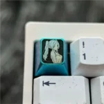 Frieren titanium keycap, an ethereal ice crystal blue masterpiece crafted from premium titanium alloy, shines with magical world aesthetics.