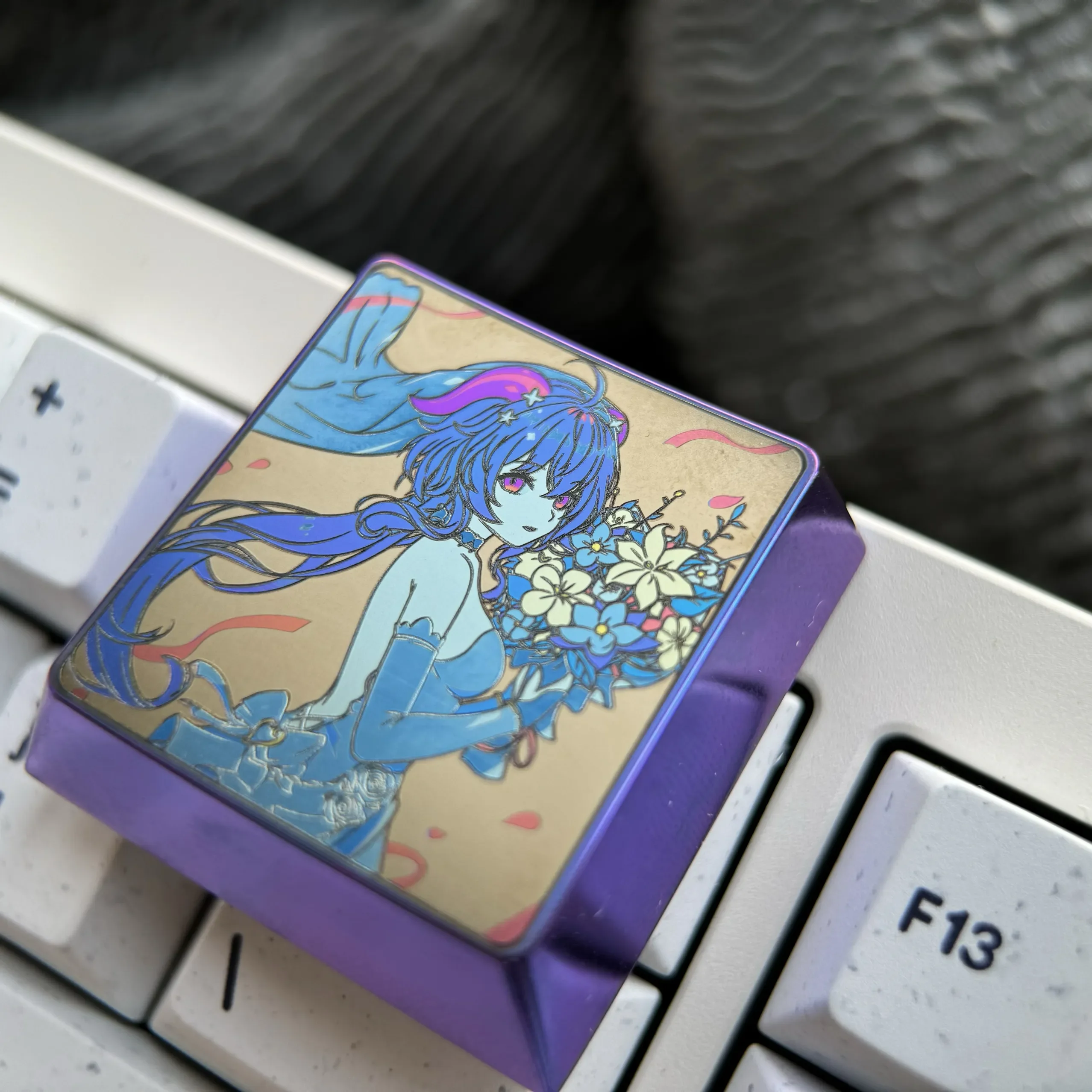 Ganyu Titanium Keycap artisan gallery, displaying the luminous blue titanium finish, detailed Ganyu character art, and premium metallic quality.