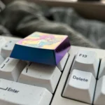 Exquisite Ganyu Titanium Keycap, focus on its premium luminous blue titanium and with detailed Ganyu-inspired character art for a collectors keyboard.