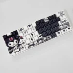 Iconic Kuromi keycaps set featuring a unique side-engraved design and sleek black transparent finish. Showcases rebellious Kuromi art for a dark design.
