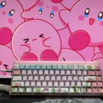 Gallery of playful Kirby pink keycaps for mechanical keyboards. Displays iconic Kirby designs and aesthetics, multi-angle, for personalization.