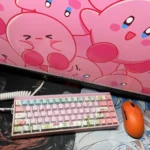 Playful gallery of vibrant pink Kirby keycaps. View iconic character designs from multiple angles, perfect for whimsical keyboard personalization.