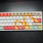 Playful McDonald's Themed Keycap Set gallery: iconic red and yellow designs from all angles. Experience pop culture fun and playful nostalgia on your keyboard.