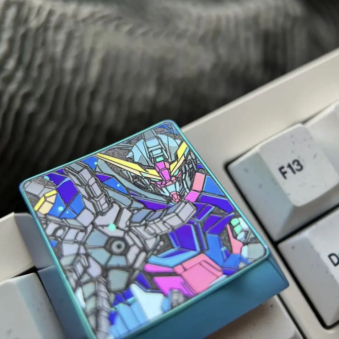 Anodized Mobile Suit Gundam titanium keycap gallery. Showcases its premium titanium alloy, bold mecha design, and vibrant metallic finish from various angles for your setup.