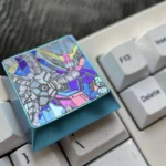 Anodized Mobile Suit Gundam Titanium Keycap, premium titanium alloy construction. Features its bold mecha design, industrial elegance, and vibrant metallic sheen.