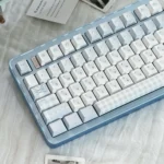 Monsoon Keycap Set: exquisite blue Cherry keycaps. Deep blues, gentle whites, subtle grays. Artistic rain and water patterns, serene from every angle.