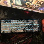 A set of Trafalgar Law-themed keycap Set, displayed from multiple angles, clearly showcases its unique side-printed characters and backlighting effects, injecting the keyboard with the vitality of the ONE PIECE world.