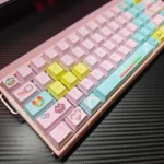 A full set of vibrant retro pixel art keycap set front-engraved with charming 8-bit designs, displayed from various angles to showcase their nostalgic.