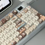 An adorable collection of Siamese cat bakery keycaps, showcasing whimsical pastel and round MOA profile designs. Perfect for a playful, charming setup.