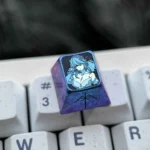 Multiple views of the Premium Titanium Lyfe Keycap from Snowbreak: Containment Zone, highlighting Lyfe's icy blue futuristic anime design.