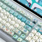 A comprehensive view of the vibrant Hatsune Miku keycap set, displaying various keycaps with playful character art and musical notes.