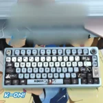 Vibrant K-On! Akiyama Mio PBT pudding keycap set showcasing playful anime art and translucent sides, perfect for RGB custom keyboards.