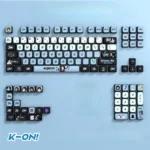 Vibrant K-On! Akiyama Mio PBT pudding keycap set displayed in a gallery, highlighting character art and translucent sides for custom RGB anime.