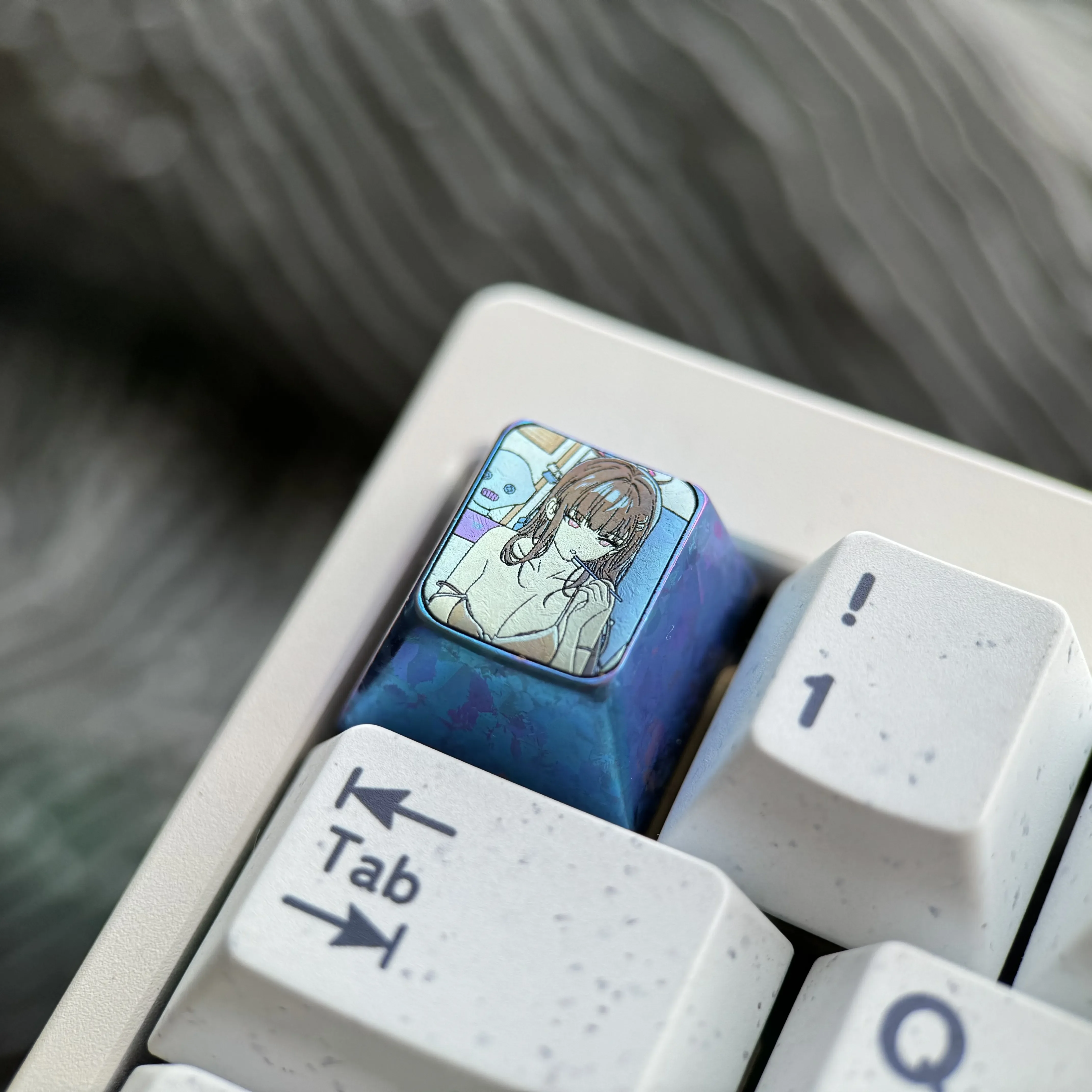 Multiple views of the TRio Tsukatsuki premium titanium alloy anime keycap, showcasing vibrant character art and meticulous craftsmanship from various design.