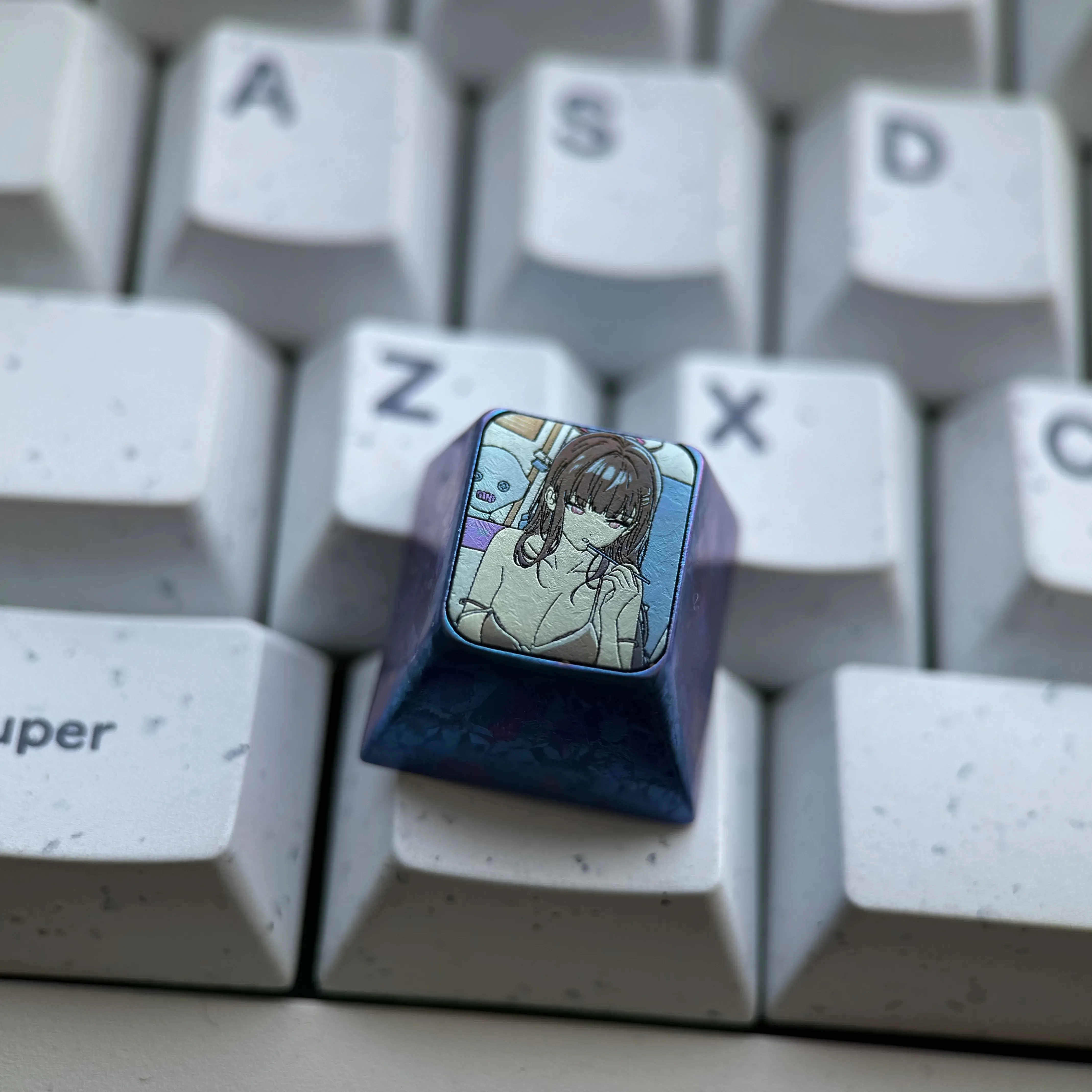 Gallery showcasing the premium Rio Tsukatsuki Anime Keycap from various angles, highlighting its detailed titanium alloy sculpting and vibrant design.