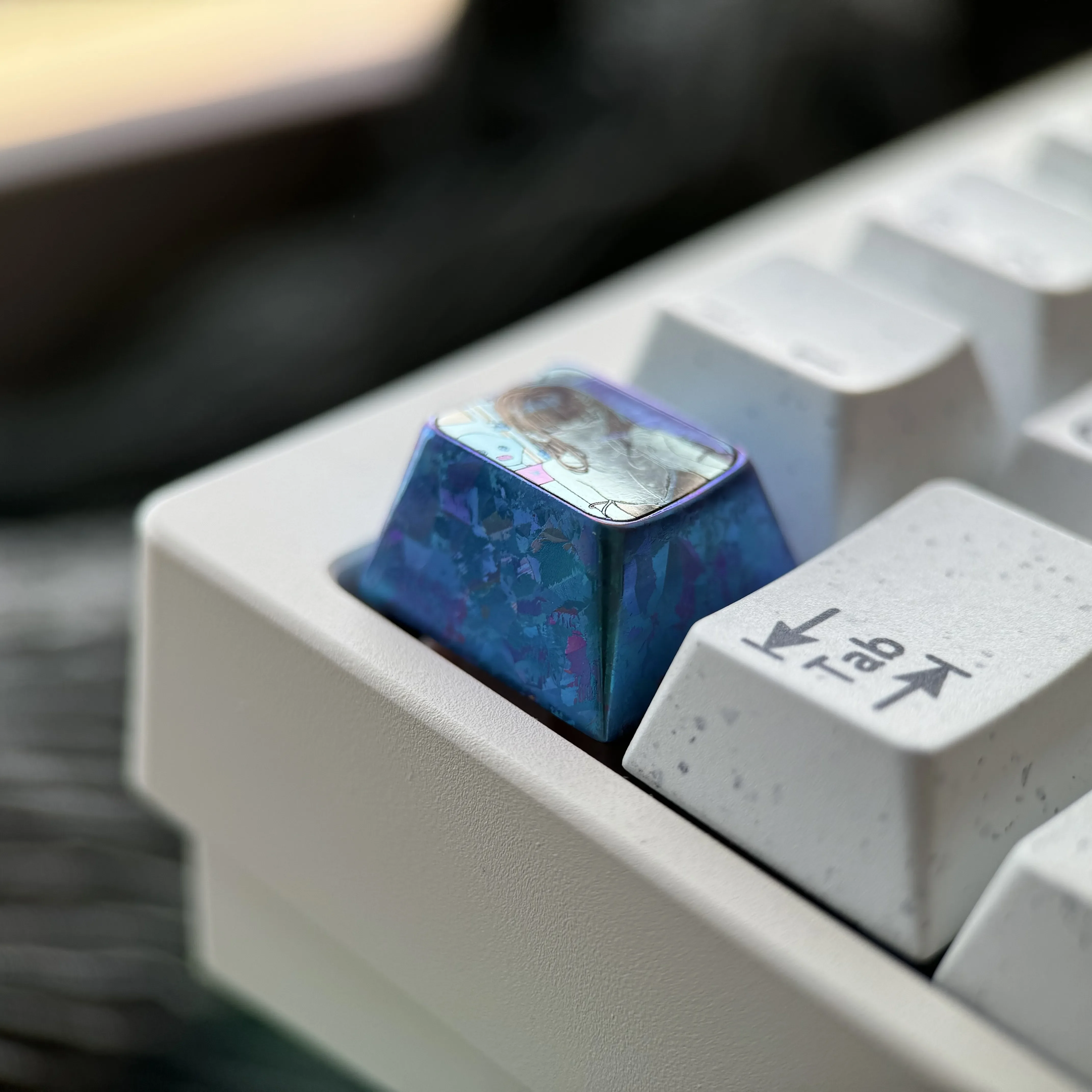 Vibrant Rio Tsukatsuki anime keycap crafted from premium titanium alloy, displayed from various angles highlighting its sculpted art and metallic finish.