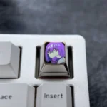 Exclusive Shinjo Akane anime titanium ESC keycap. Striking purple, vibrant character art, and premium metallic craftsmanship for custom mechanical keyboard.