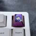 Premium Shinjo Akane anime titanium ESC keycap. Gallery view highlights vibrant purple design and exquisite metallic craftsmanship for customization.