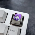 Exclusive Shinjo Akane anime titanium ESC keycap. Vibrant purple character art showcases premium metallic craftsmanship for custom keyboards.