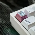 Product gallery of the exclusive Sumireko Sanshokuin Anime Titanium Keycap, featuring its ice crystal purple finish and vibrant anime character art.