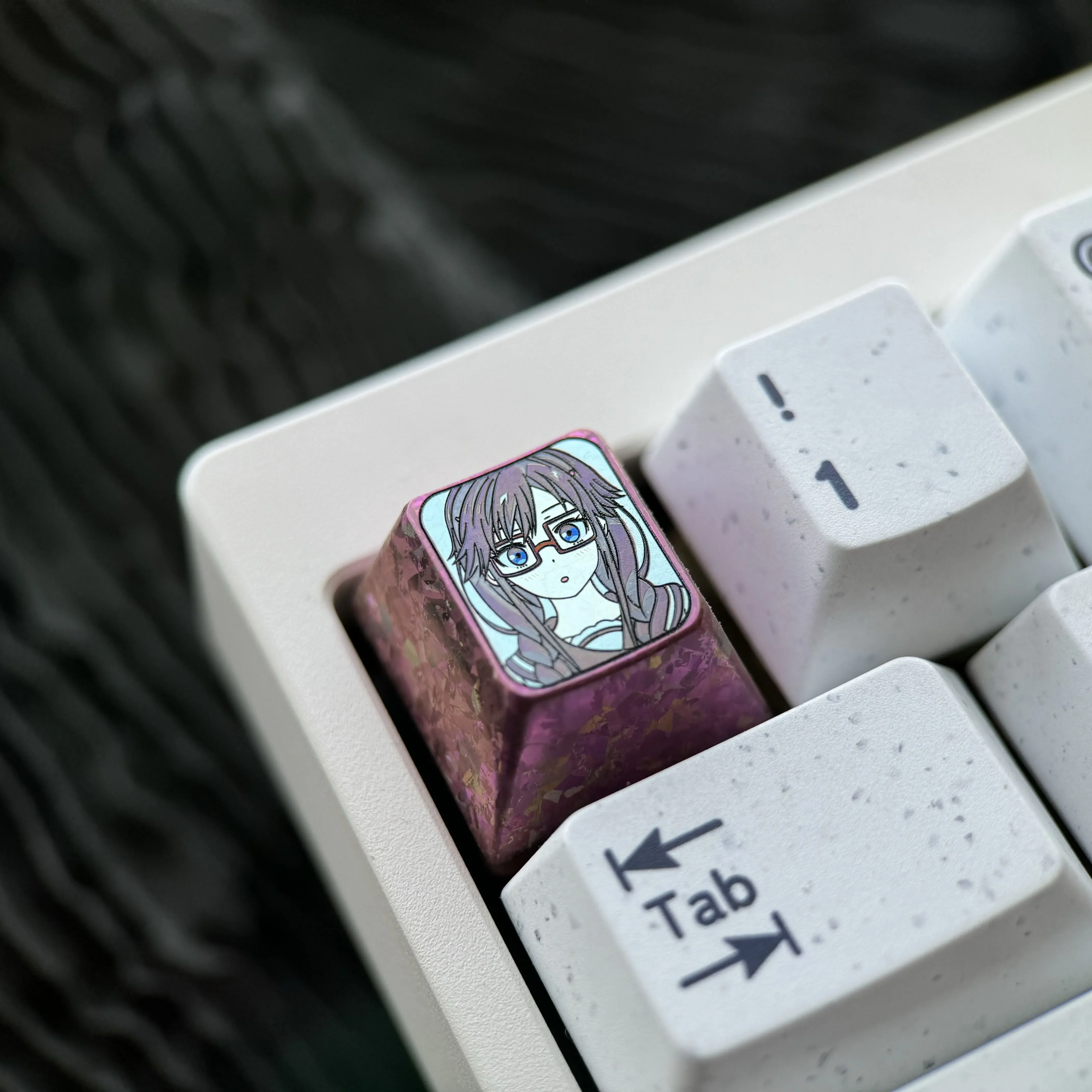 Sumireko Sanshokuin Anime Titanium Keycap. Exclusive ice crystal purple, vibrant character art. Premium metal art showcased from angles.