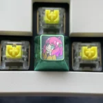 Artistic display of vibrant Anya Forger titanium alloy keycaps, capturing iconic Spy x Family anime flair with lustrous detail.