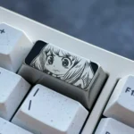 Anya Titanium Keycap gallery showcasing its premium engraved Anya Forger design, sophisticated dark grey titanium, and impeccable craftsmanship.