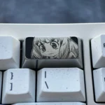 Anya Titanium Keycap gallery reveals the premium engraved 2U backspace with iconic Anya Forger design and sophisticated dark grey metallic finish.