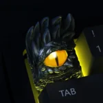 Captivating red-eyed artisan keycap, a handmade custom ESC masterpiece depicting a mysterious creature with dark, unique craftsmanship.