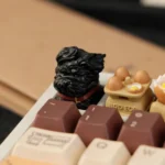 Multiple gallery views of the whimsical black puppy artisan keycap, highlighting its unique handcrafted resin artistry for mechanical keyboards.