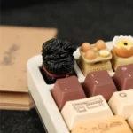 This gallery showcases the handcrafted resin whimsical black puppy artisan keycap, revealing its unique artistic detail and delightful charm.