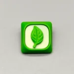Close-up of a handcrafted green leaf resin keycap, an artistic custom artisan piece bringing a serene touch of nature to MX keyboards.