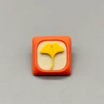 Handcrafted leaf resin keycap for MX switches, featuring a serene, whimsical nature design, showcasing its unique artisan craftsmanship.