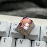 Exquisite hand-carved titanium Asuka keycap, showcasing vibrant anime detail, intricate metallic sculpture, and premium finish.