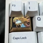 Precision-crafted Asuka titanium keycap main image, highlighting iconic fine-line art and vibrant premium titanium finish.