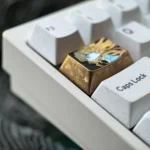 A gallery of the Precision-Crafted Asuka Titanium Keycap, showcasing its iconic fine-line art and premium titanium finish from various angles.