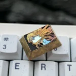 Detailed gallery views of the Asuka titanium keycap, showcasing its iconic fine-line art and vibrant premium titanium finish. Precision-crafted art.
