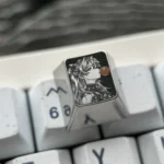 Iconic Asuka titanium keycap for ESC, showcasing premium pointillist artisan craftsmanship in a dreamy bubble scene.