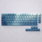 Vibrant Aurora Borealis PBT keycaps set displaying mystical gradients of deep blue and emerald green, transforming your setup.