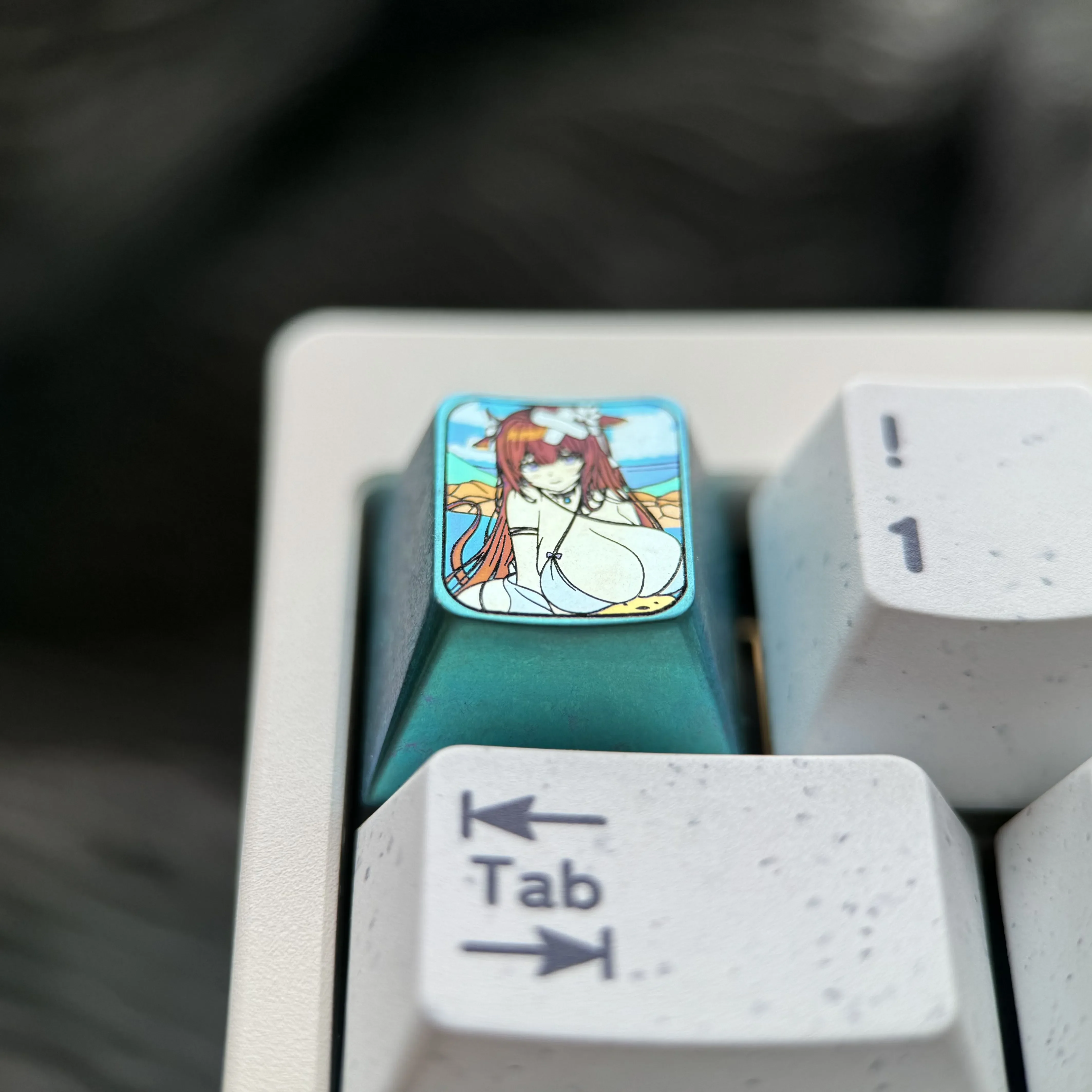 Azur Lane Kashino titanium keycap gallery showcasing its vibrant anime design and elegant icy-blue metallic finish. Premium artisan collectible.
