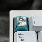 Premium Azur Lane Kashino titanium keycap with vibrant anime character art, featuring an elegant icy-blue metallic finish, a collectible artisan keycap.