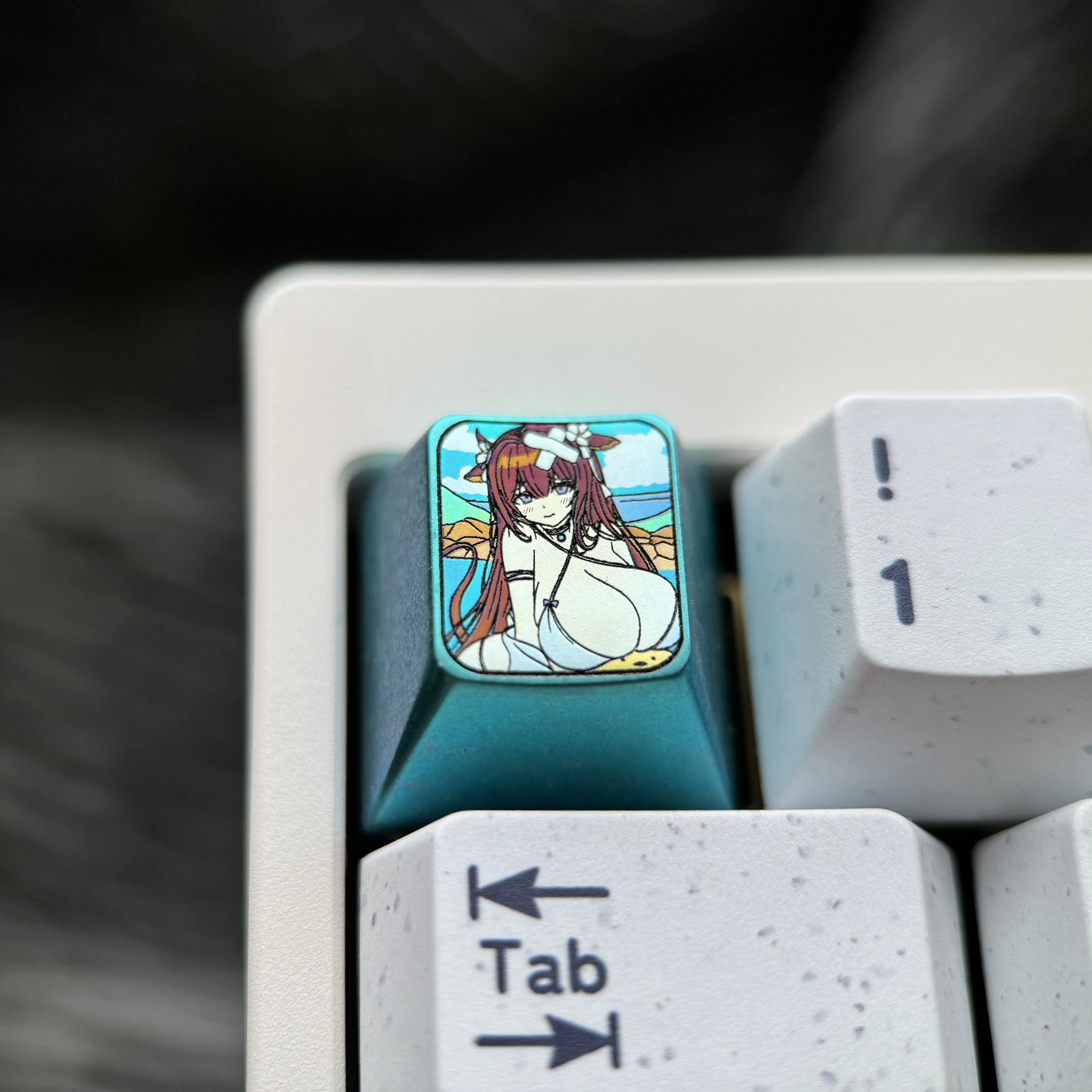 Premium Azur Lane Kashino titanium keycap with vibrant anime character art, featuring an elegant icy-blue metallic finish, a collectible artisan keycap.