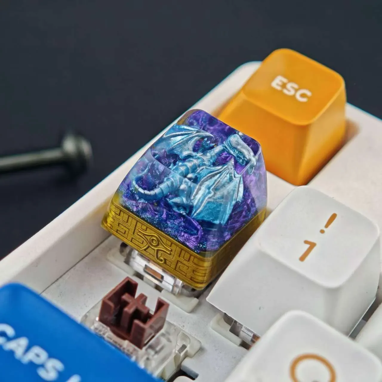 Gallery views of the iconic Blue-Eyes White Dragon translucent resin keycap. Intricate mythical dragon, vibrant glow, artistic design for gaming.
