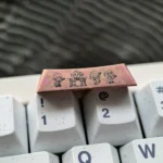 Gallery of the exclusive Bocchi the Rock! titanium keycap. Views highlight vibrant anime art and polished titanium finish, a premium Bocchi Keycap.