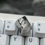 Explore the Bocchi the Rock!: Hitori Gotoh Titanium Keycap from multiple angles, showcasing intricate pointillism art on polished silver.