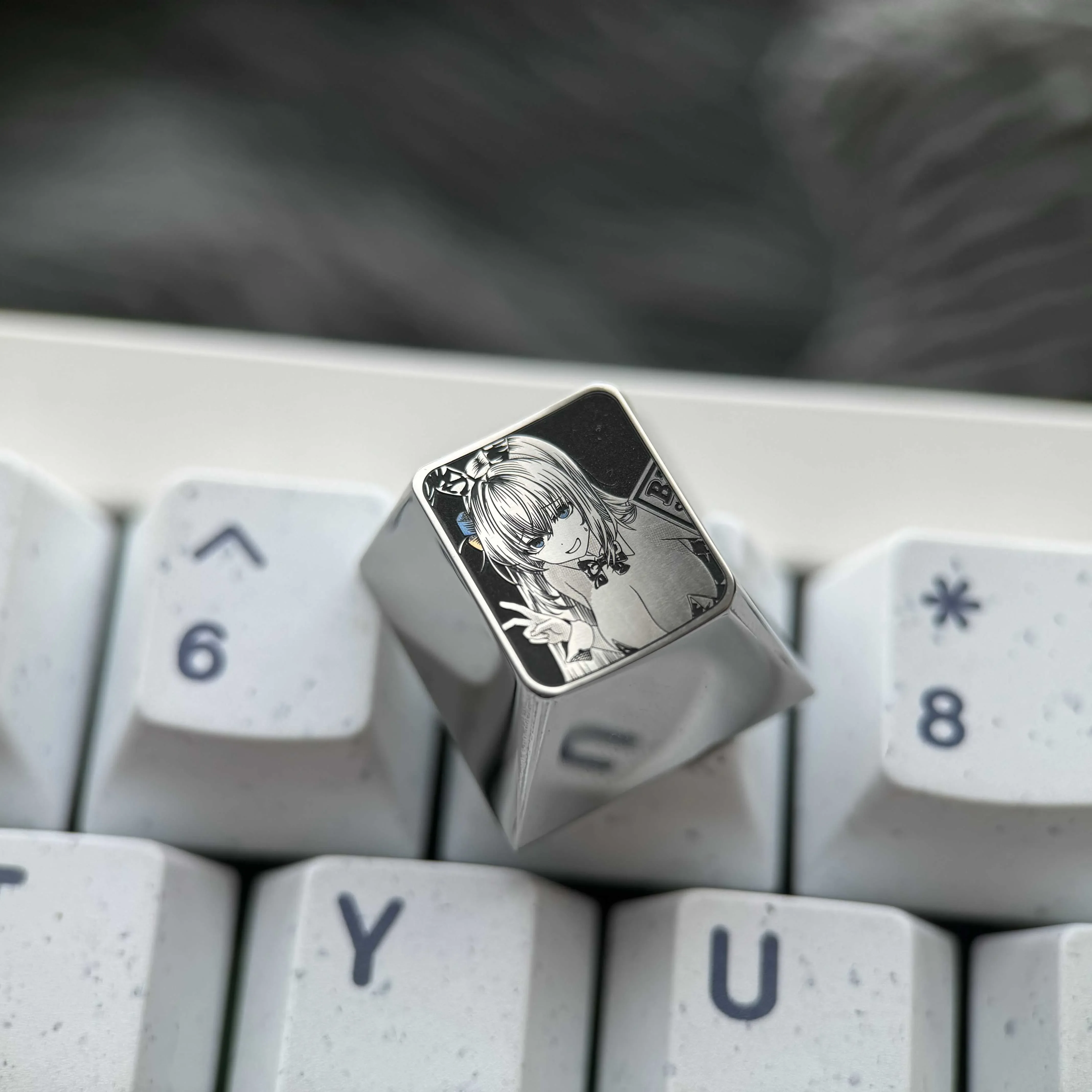 Explore the Bocchi the Rock!: Hitori Gotoh Titanium Keycap from multiple angles, showcasing intricate pointillism art on polished silver.
